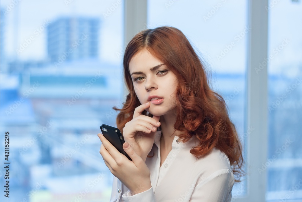 pretty woman in shirt with phone in hand technology professional official pretty woman in shirt with phone in hand technology professional official