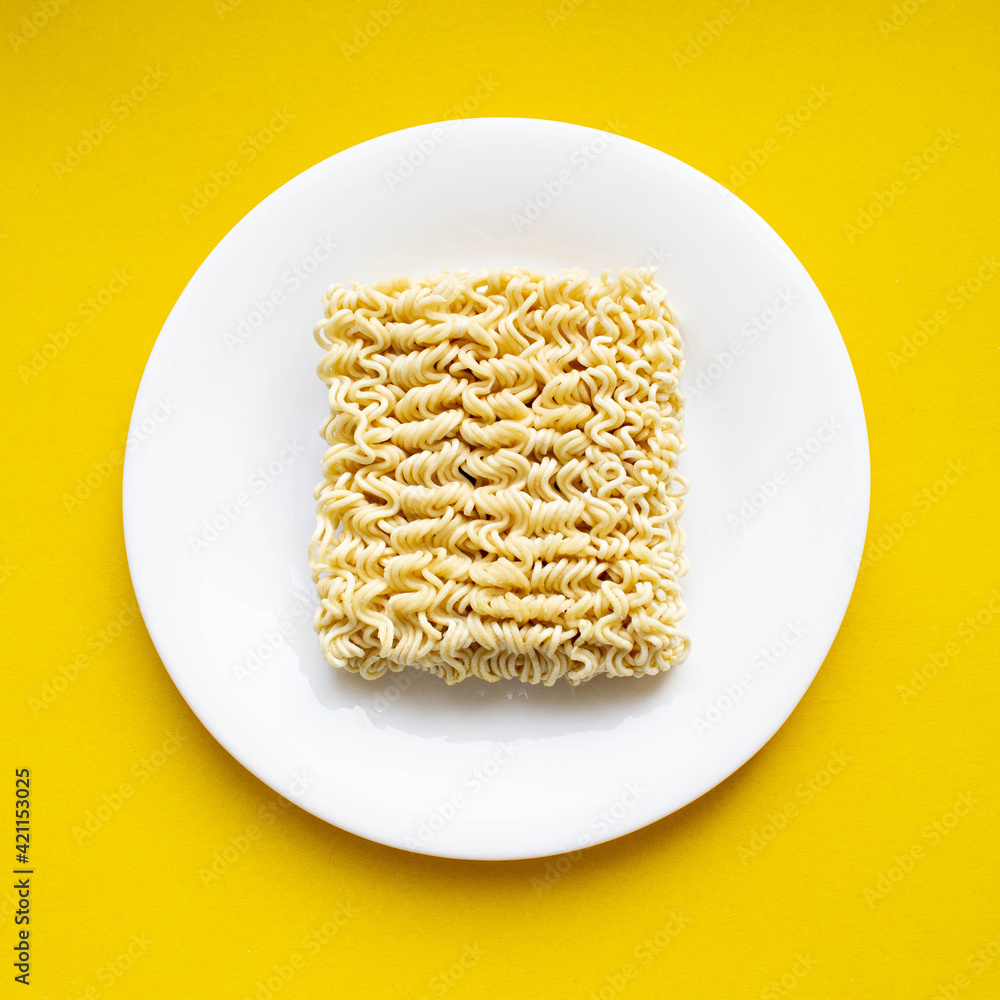 Noodles on a plate. Vermicelli in the shape of a square on a round plate. Noodles on a plate. Vermicelli in the shape of a square on a round plate.