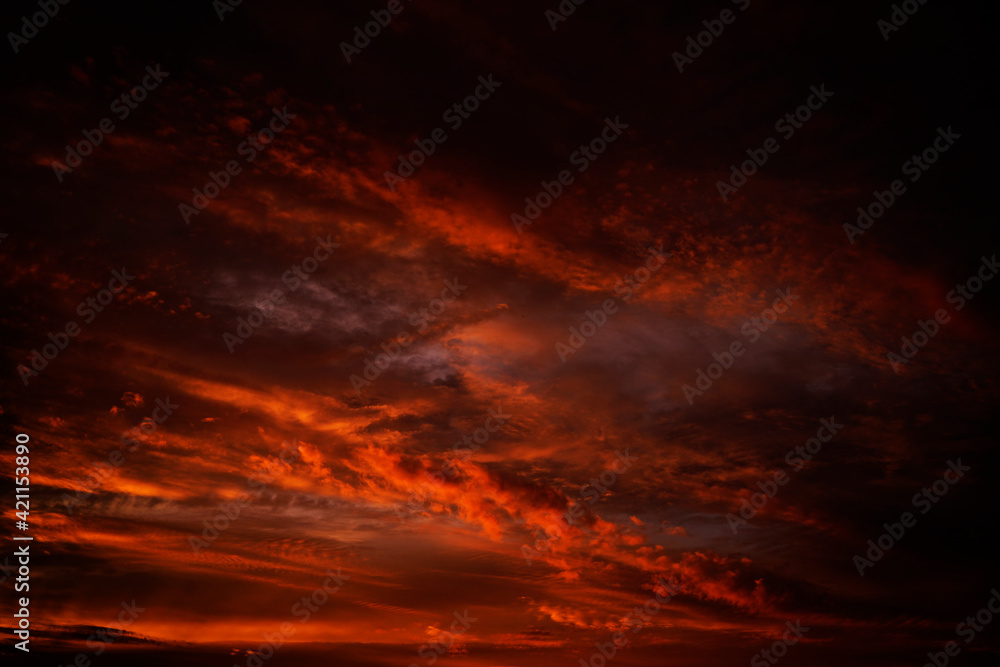 Abstract dark red background. Dramatic fiery bloody sky. Fantastic golden sunset background with copy space for design. Halloween, evil, armageddon, apocalypse concept. Web banner. Abstract dark red background. Dramatic fiery bloody sky. Fantastic golden sunset background with copy space for design. Halloween, evil, armageddon, apocalypse concept. Web banner.