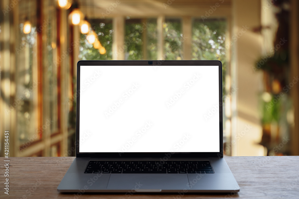 laptop on wooden table with bokeh background. laptop on wooden table with bokeh background.