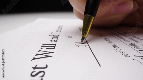Motorized moving shot of writing a last will with placeholder name, shot with macro probe lens