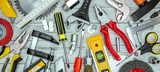 set of hand various work tools on grey background top view including different kinds of wrenches, pliers, clamps, calipers and other