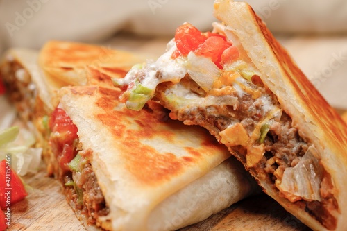 Εκτύπωση καμβά A close up photo of a homemade crunch wrap taco on a cutting board