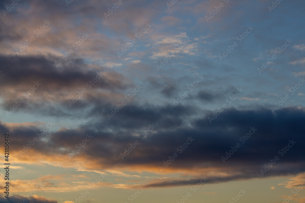 Dark blue clouds. Blue sky, sunset. Natural background.