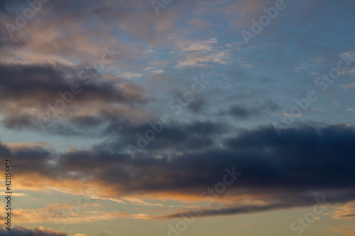 Dark blue clouds. Blue sky, sunset. Natural background. © Stepanov Aleksei
