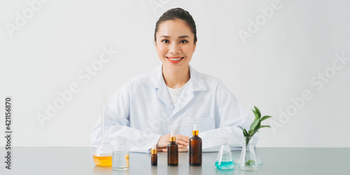 scientist or doctor making herbal medicine with herb leaves , capsule, tablets.hands.