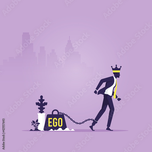 Concept of ego, confident business man with crown on head and big weight chained to foot
