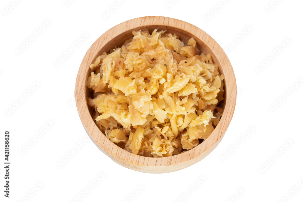 Pickled White Radish in a wooden cup on a white background. Pickled White Radish in a wooden cup on a white background.