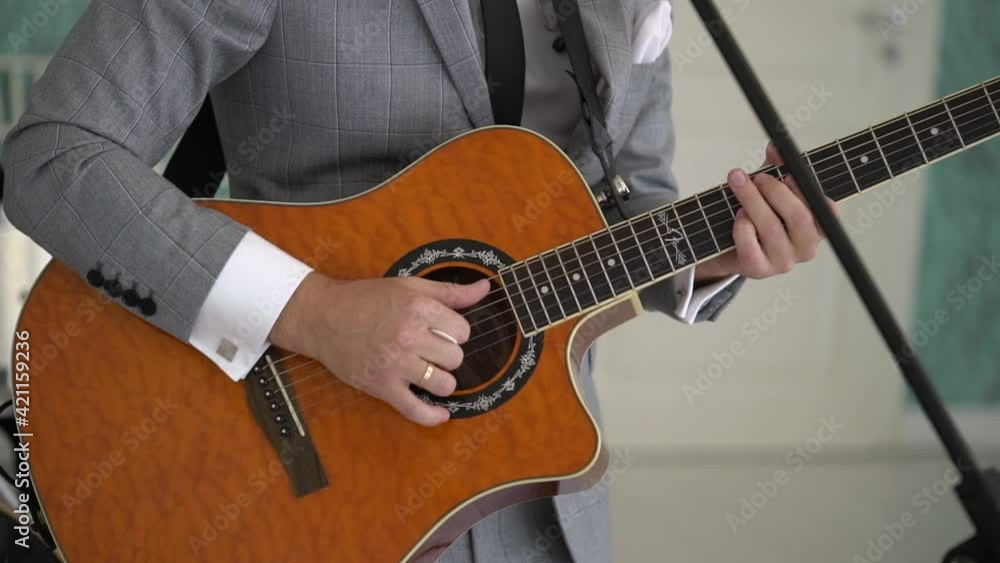 Guitarist man playing guitar at concert. Band at the stage, musician playing music. High quality FullHD footage Guitarist man playing guitar at concert. Band at the stage, musician playing music. High quality FullHD footage