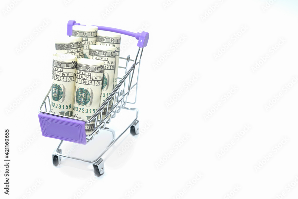 Concept background of hundred dollar bills on a small cart