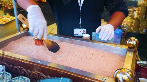 Preparing coffee on the sand, Global Village Dubai, UAE photo