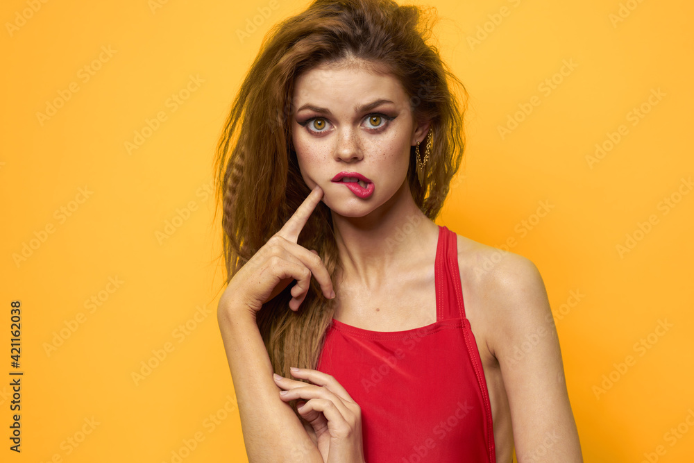 emotional woman wavy hair bright makeup lifestyle yellow background emotional woman wavy hair bright makeup lifestyle yellow background