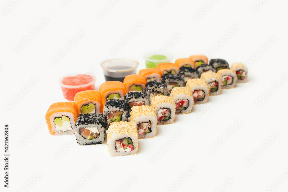 Set of rolls. Many different rolls. Japanese food.Chinese food. Sushi. Sushi of different colors. Set of rolls. Many different rolls. Japanese food.Chinese food. Sushi. Sushi of different colors.