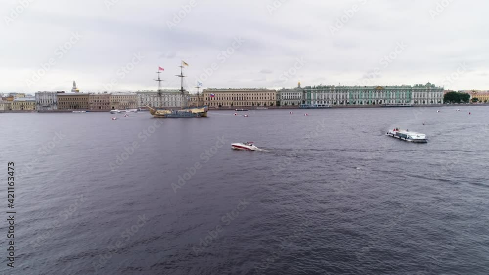 Speedboat motor yacht sail in a City river Neva with view at Isaac cathedral and Rostral columns aerial. High quality FullHD footage