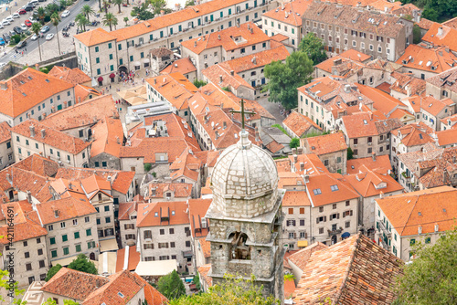 Ariel view of Church of Our Lady of Remedy with Old Town in the background, Kotor, Montenegro.