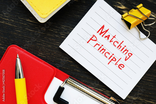 Business concept meaning Matching Principle with phrase on the piece of paper. photo