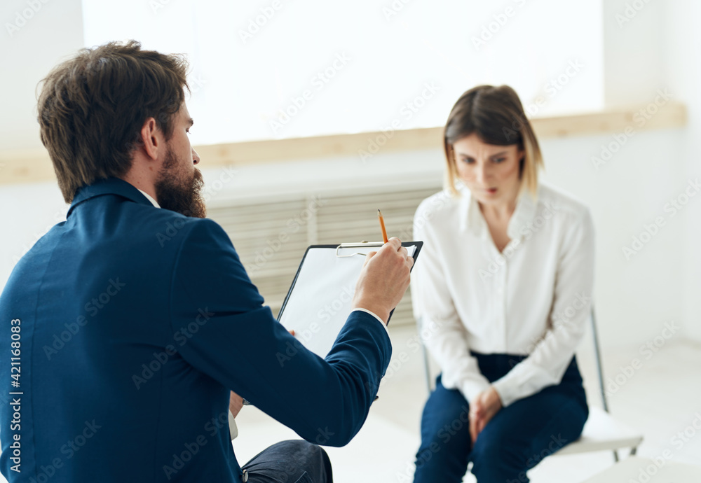 A man next to a woman communication discussion professional consultation mental problems A man next to a woman communication discussion professional consultation mental problems