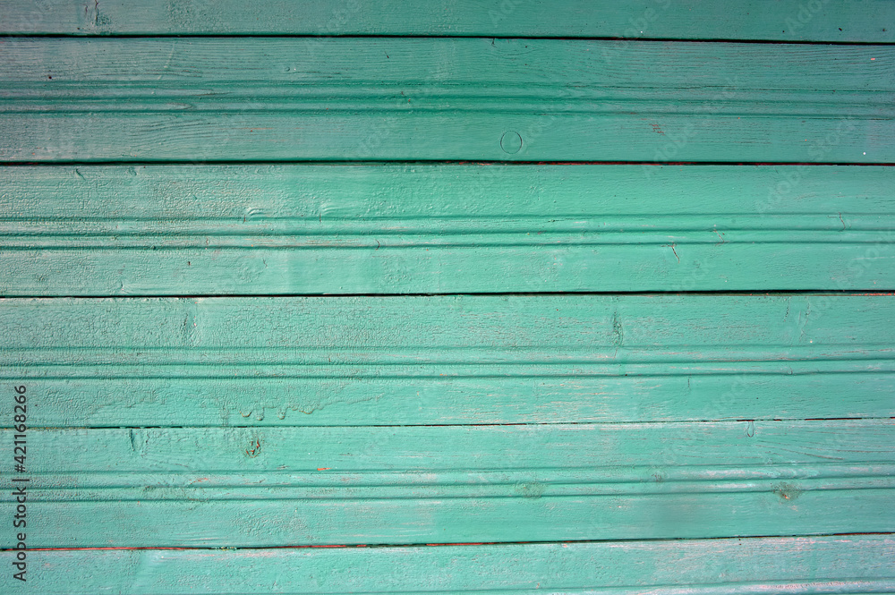 part of the wall is made of boards clapboard painted in green part of the wall is made of boards clapboard painted in green