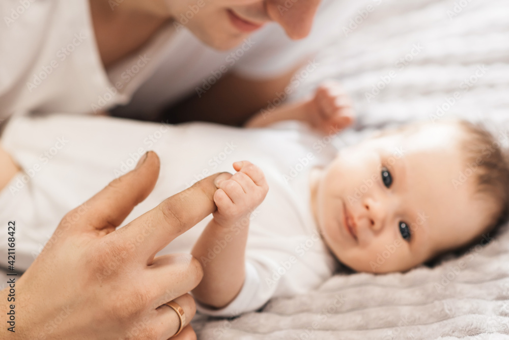 family, fatherhood and people concept - happy father holding little baby daughter at home family, fatherhood and people concept - happy father holding little baby daughter at home