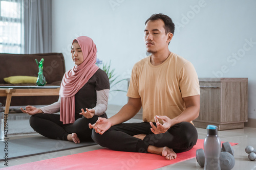 Asian fitness couple, man and woman exercising together at home