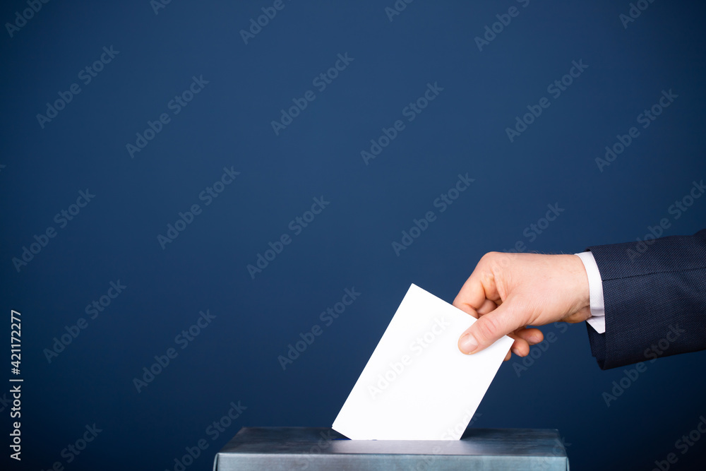 Voter Putting Ballot Into Voting box. Voter Putting Ballot Into Voting box.