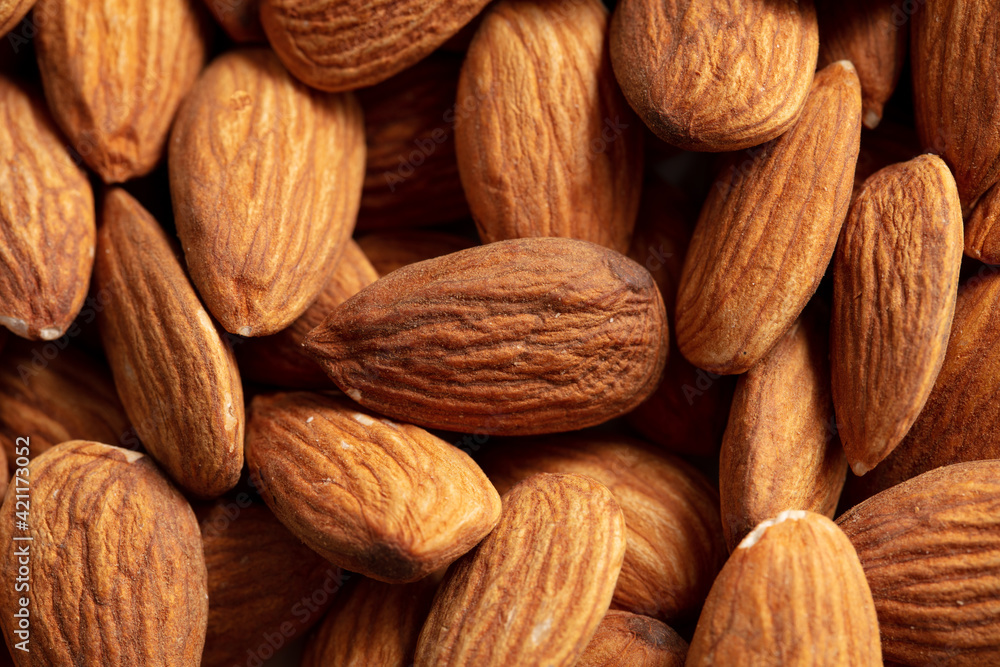 Close up of almond nuts as background. Close up of almond nuts as background.