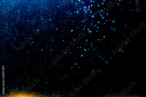 Glittering stars of blur blue bokeh