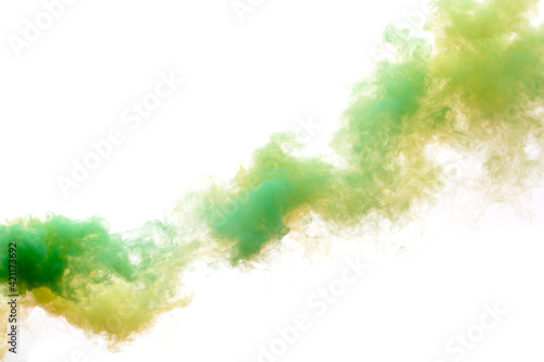 Green and yellow smoke isolated on a white