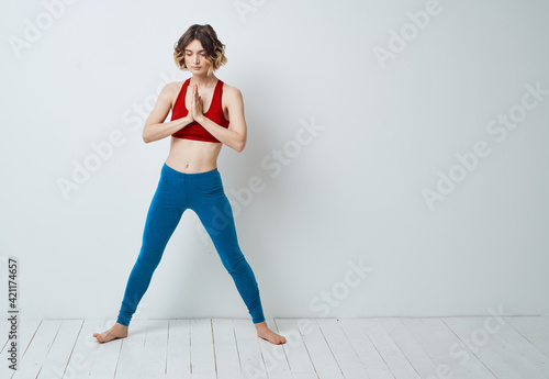 Woman spread her legs bent forward sport fitness gymnastics yoga