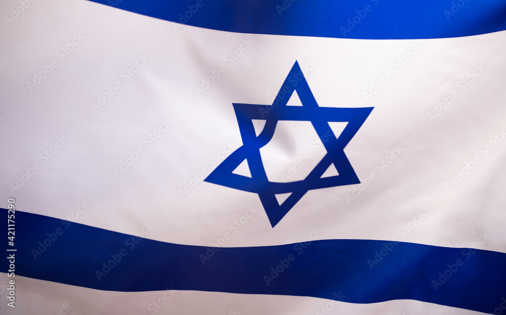 Israel flag waving against clean blue sky, close up. Israel flag waving against clean blue sky, close up.