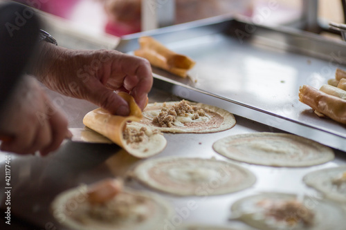 Photography cooking rolling pancake (Khanom Tokyo) thin flat pancake filled with sweet custa