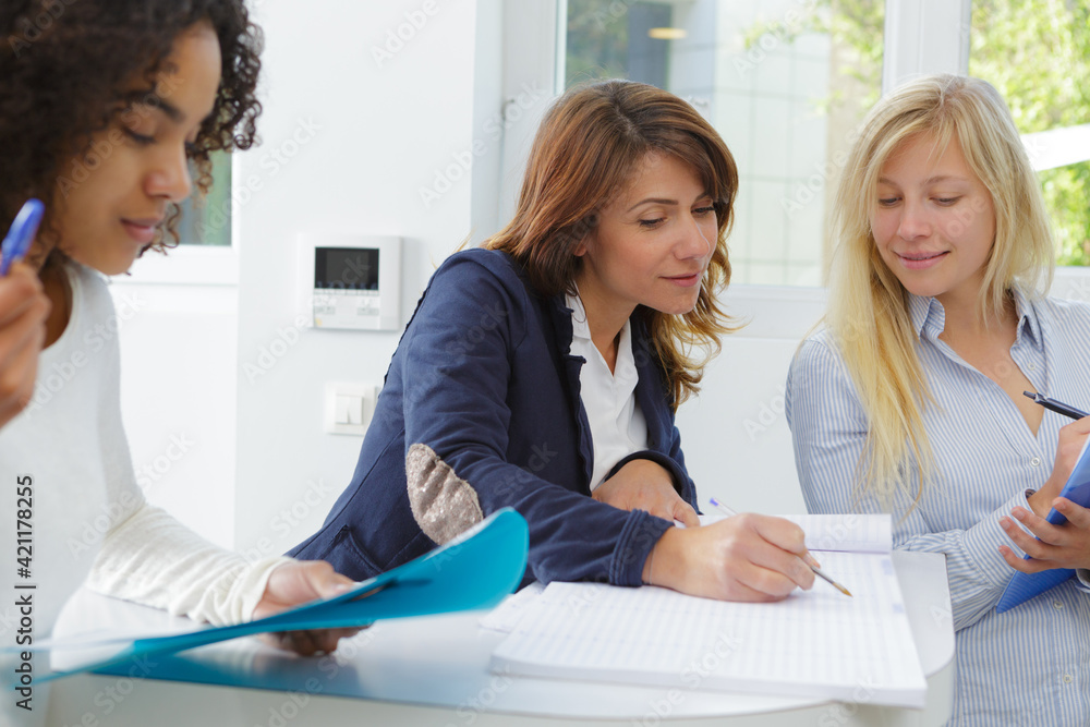 Fototapeta premium 3 women during office staff talks