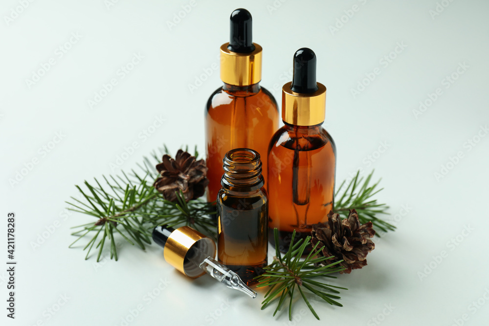 Aromatherapy concept with pine oil on white background Aromatherapy concept with pine oil on white background