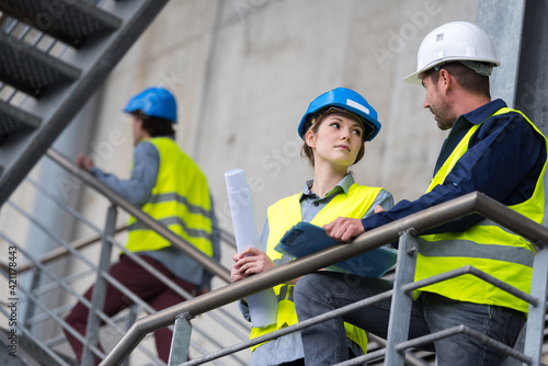 two engineers meeting at construction site