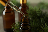 Pipette with pine oil and brown bottle, close up