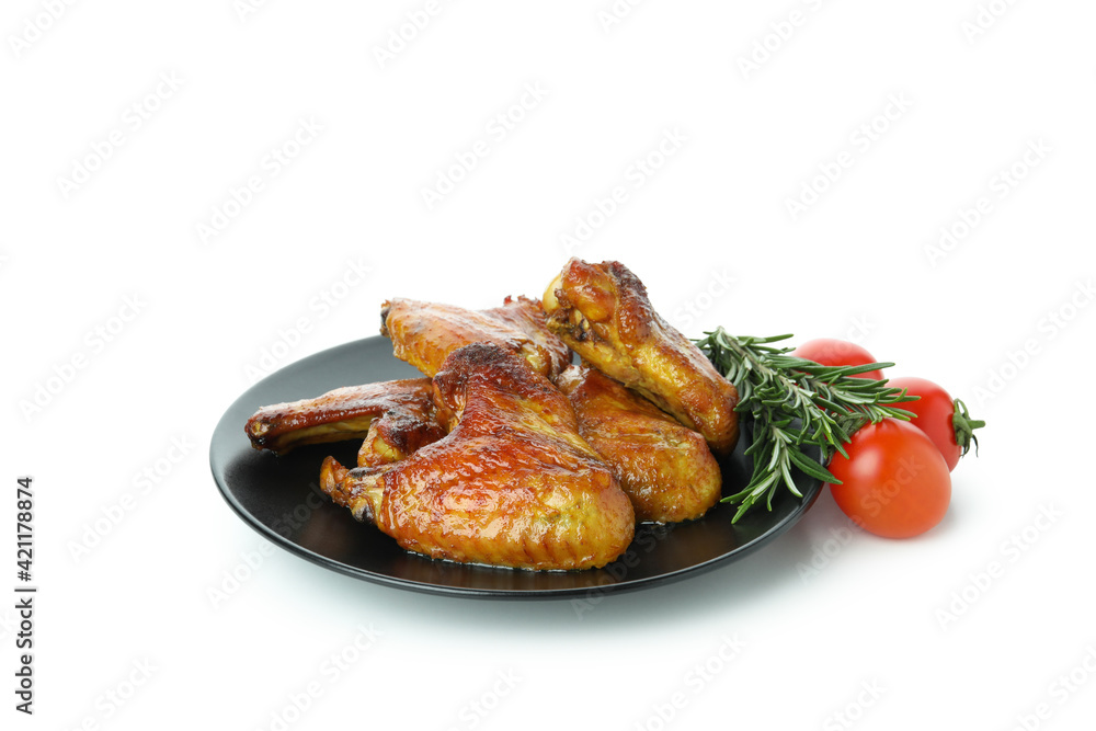 Baked chicken wings, tomatoes and rosemary isolated on white background Baked chicken wings, tomatoes and rosemary isolated on white background
