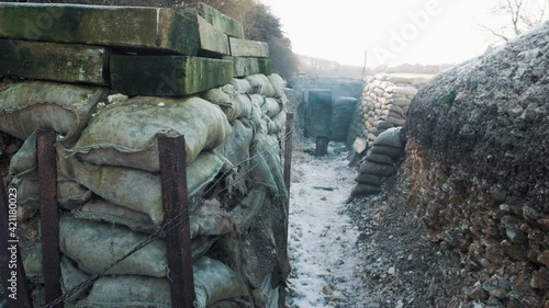 A first world war trench view with wooden planks and sand bags in France during ww1 photo