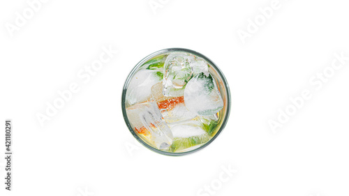 Orange lemonade with mint and ice in a clear glass isolated on a white background.