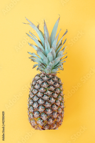Pineapple on yellow background  top view  flat lay