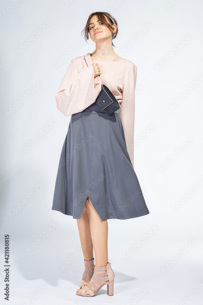 Young white woman isolated on light grey Young white woman isolated on light grey