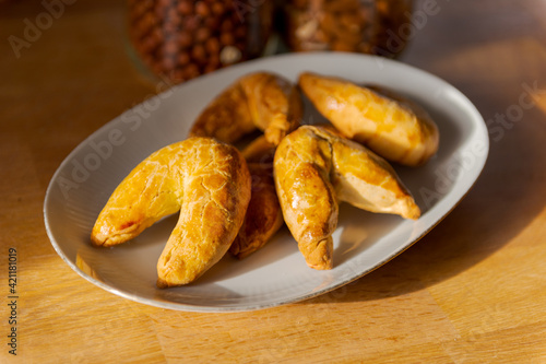 Bavarian pastry specialty Nussbeugerl fresh out of the oven on white plate photo