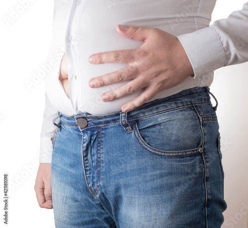 Photos Fat man in a tight white shirt with a big belly