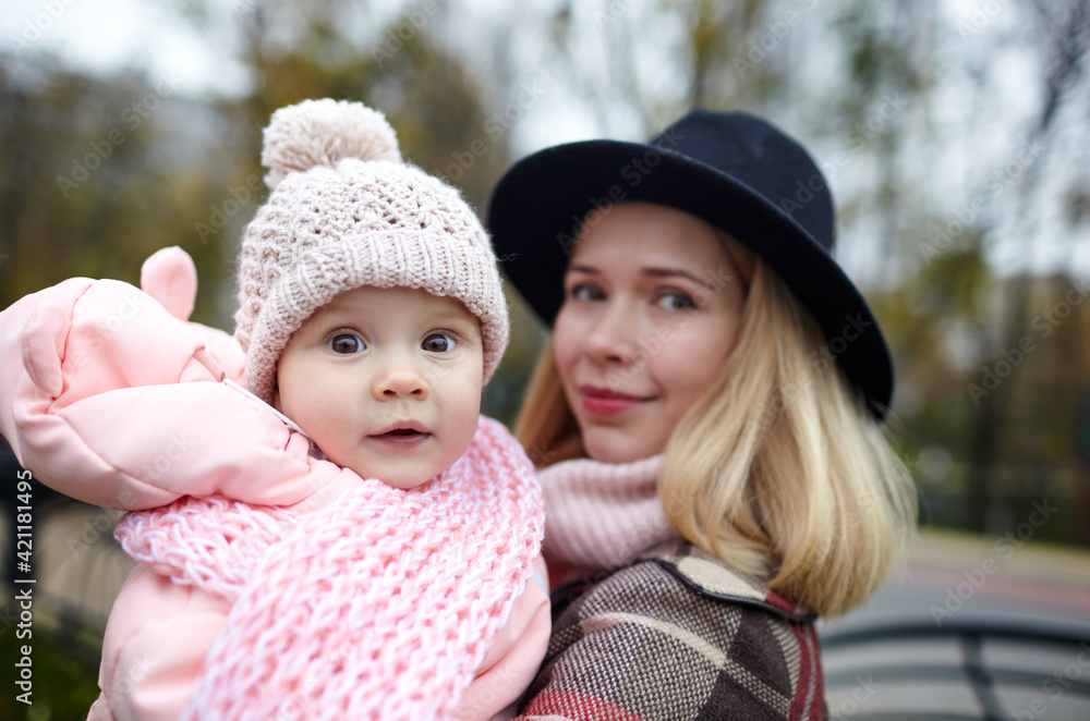 Beautiful baby girl with mother outdoors. Family outdoor Beautiful baby girl with mother outdoors. Family outdoor