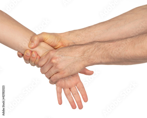 Man holding woman by wrist, pulling with force