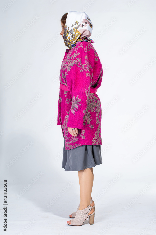 Young white girl on light grey