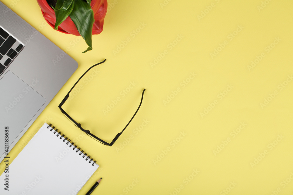 office table desk, workspace with notebook, pencil, computer, green plant and eyeglass. Business background. Flat lay, top view. copy space office table desk, workspace with notebook, pencil, computer, green plant and eyeglass. Business background. Flat lay, top view. copy space