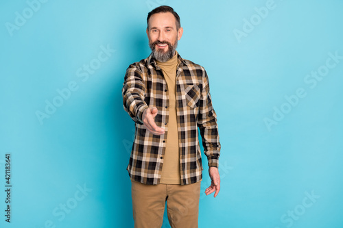 Photo portrait of aged man inviting laughing greeting nice to meet you isolated on bright blue color background