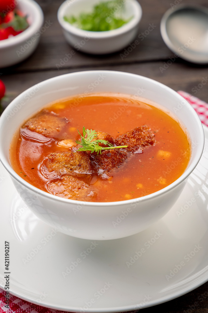 Homemade tomato soup with tomatoes, herbs and spices