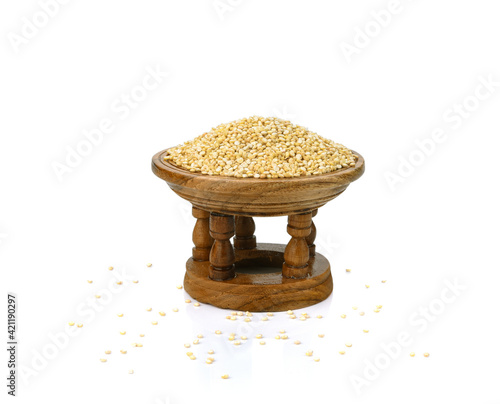 white quinoa seeds in wooden bowl isolated on white background with clipping path and full depth of field