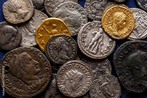 A treasure of Roman gold and silver coins.Trajan Decius. AD 249-251. AV Aureus.Ancient coin of the Roman Empire.Authentic  silver denarius, antoninianus,aureus of ancient Rome.Antikvariat. photo